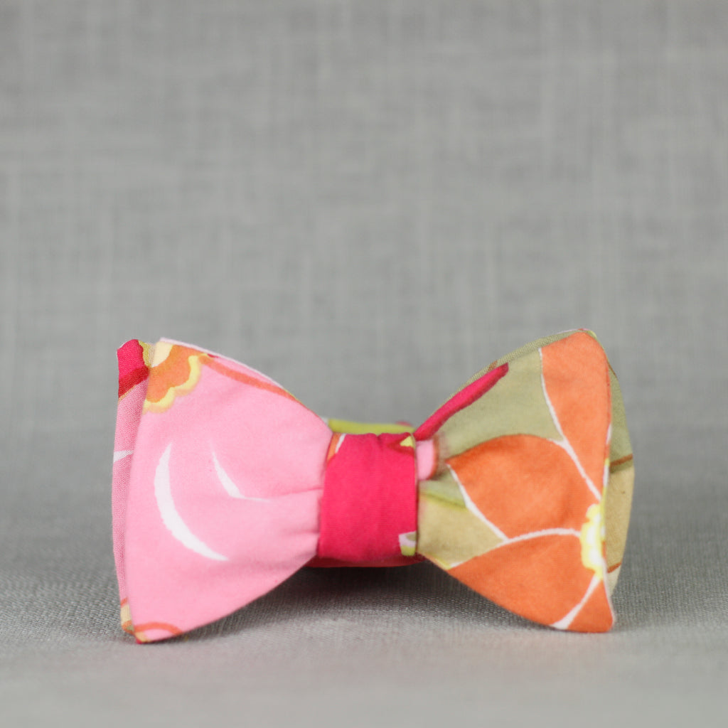 desert floral bow tie in blush pink, pistachio green, magenta, orange, olive green, & white.